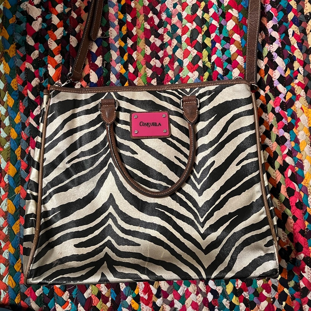 Consuela gold and black zebra print purse.